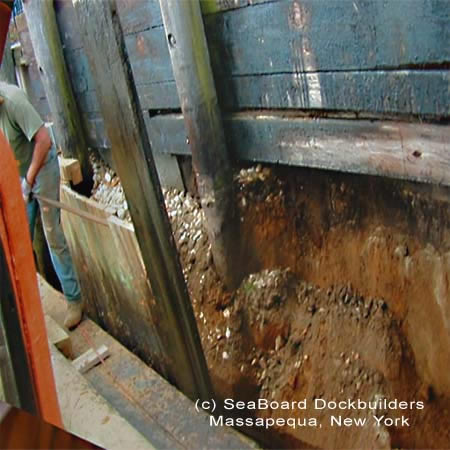 dirt esacping through old bulkheading